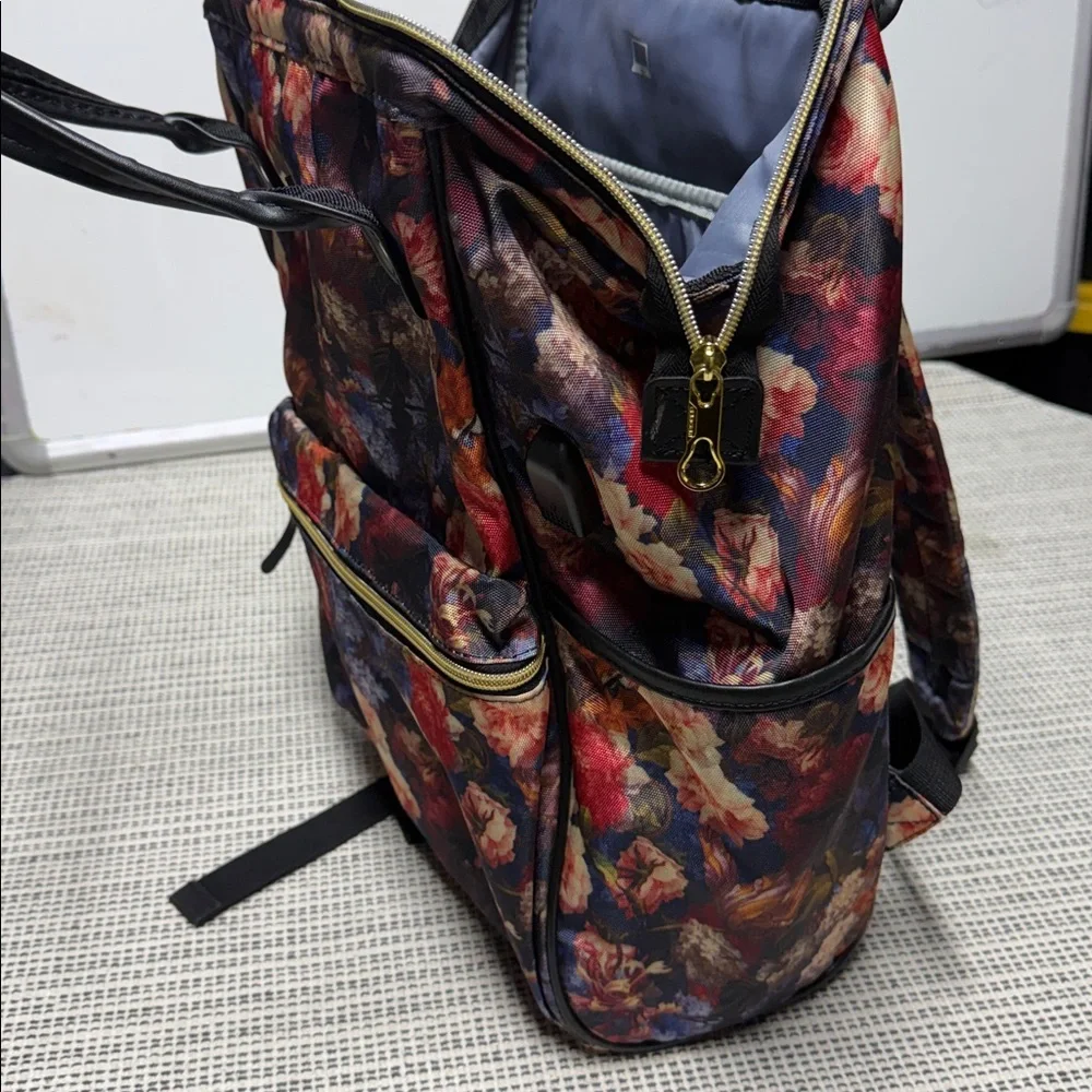 KROSER laptop backpack featuring a dark floral pattern